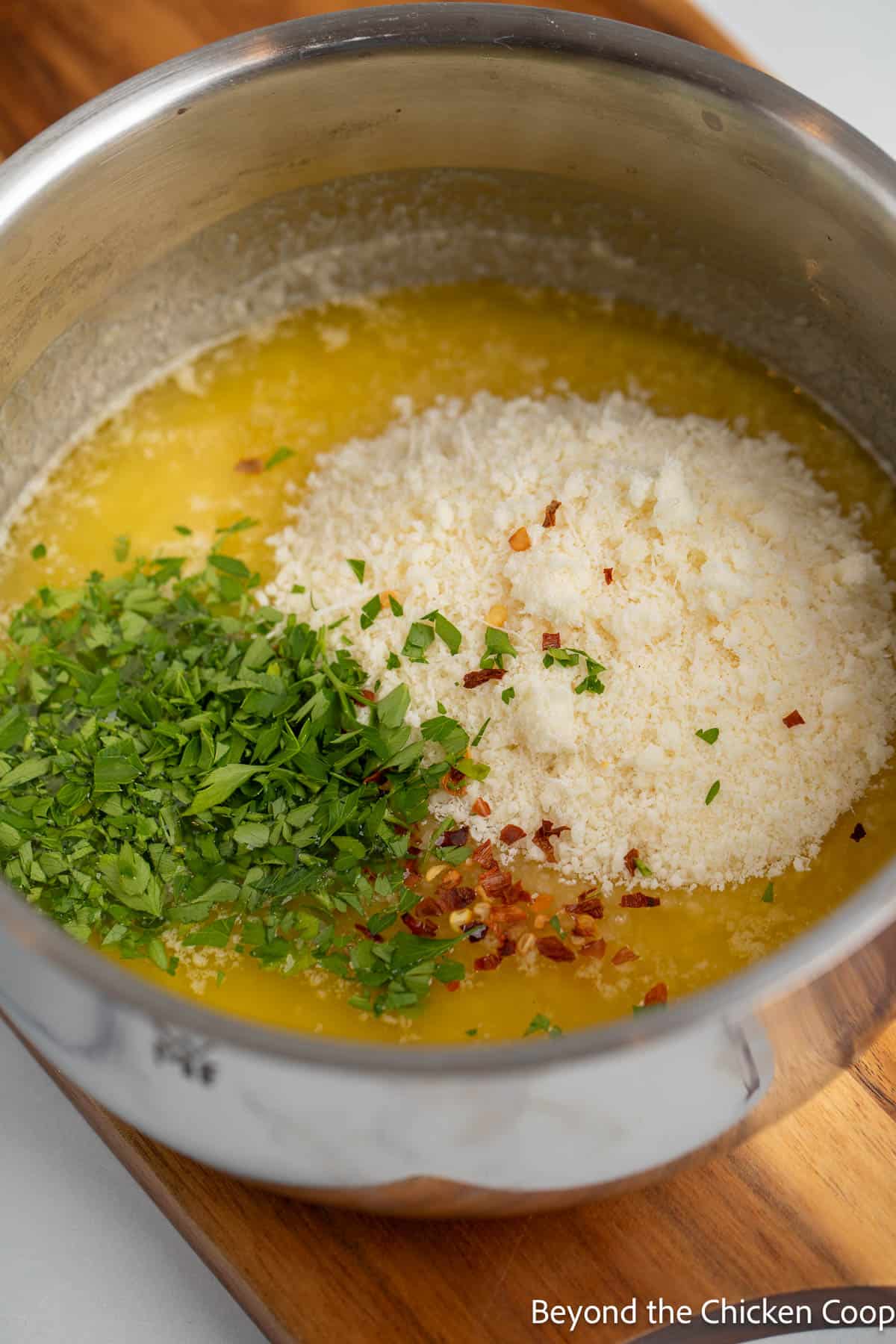 Melted butter with parsley and parmesan cheese. 