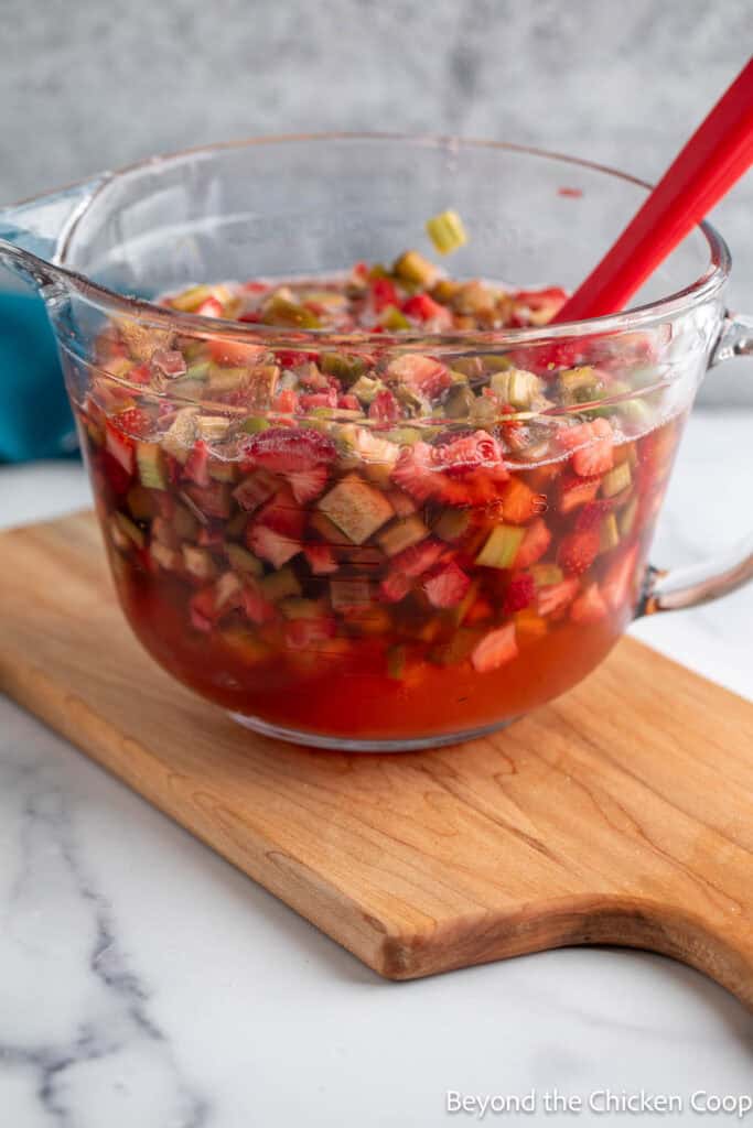 Macerated fruit with juice in a bowl. 
