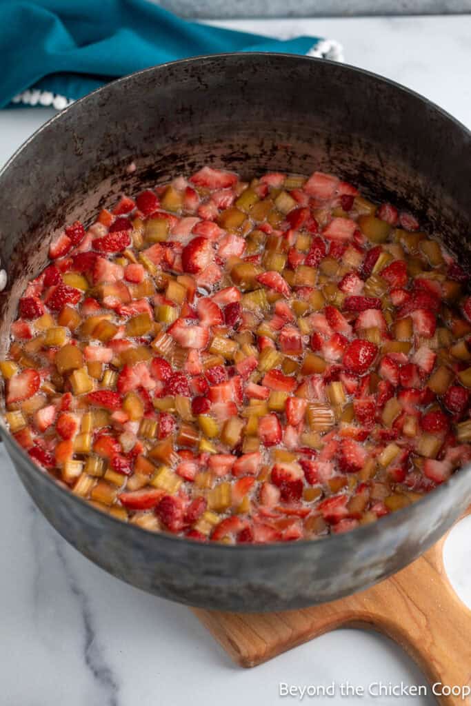 Rhubarb and strawberries in a large pot. 