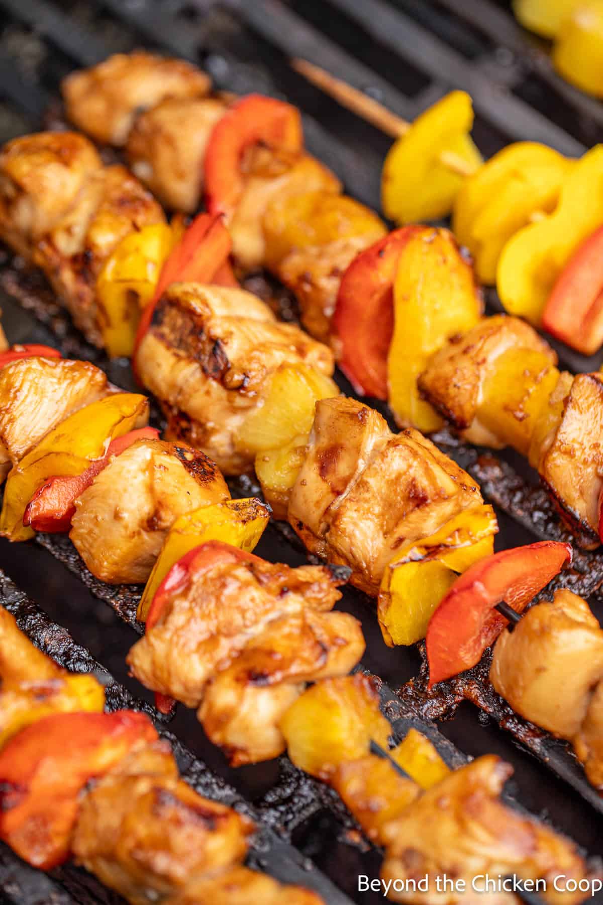 Grilled chicken skewers on the grill. 