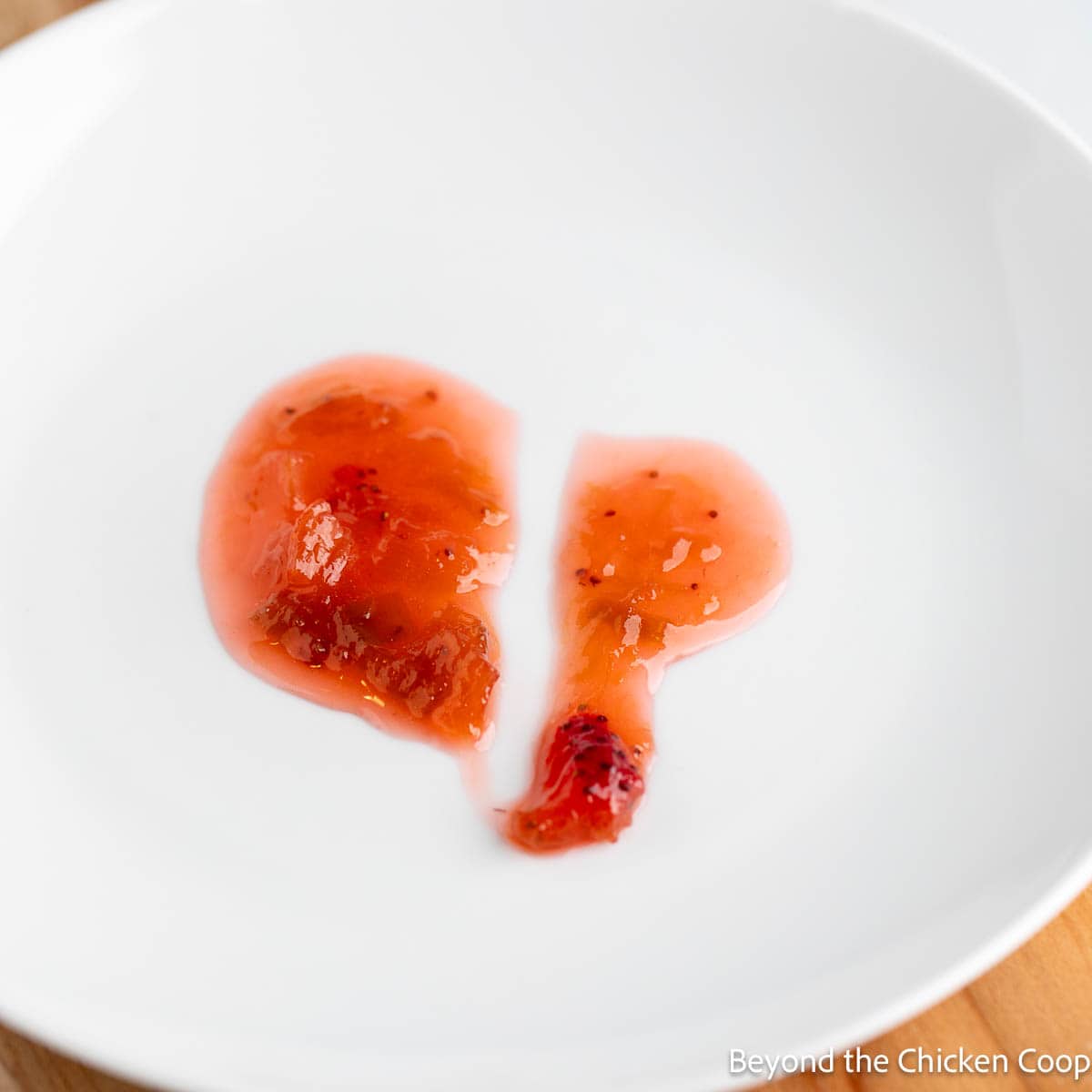 Testing the gelling stage of jam using the plate test. 