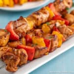 Teriyaki Chicken Skewers on a white platter.