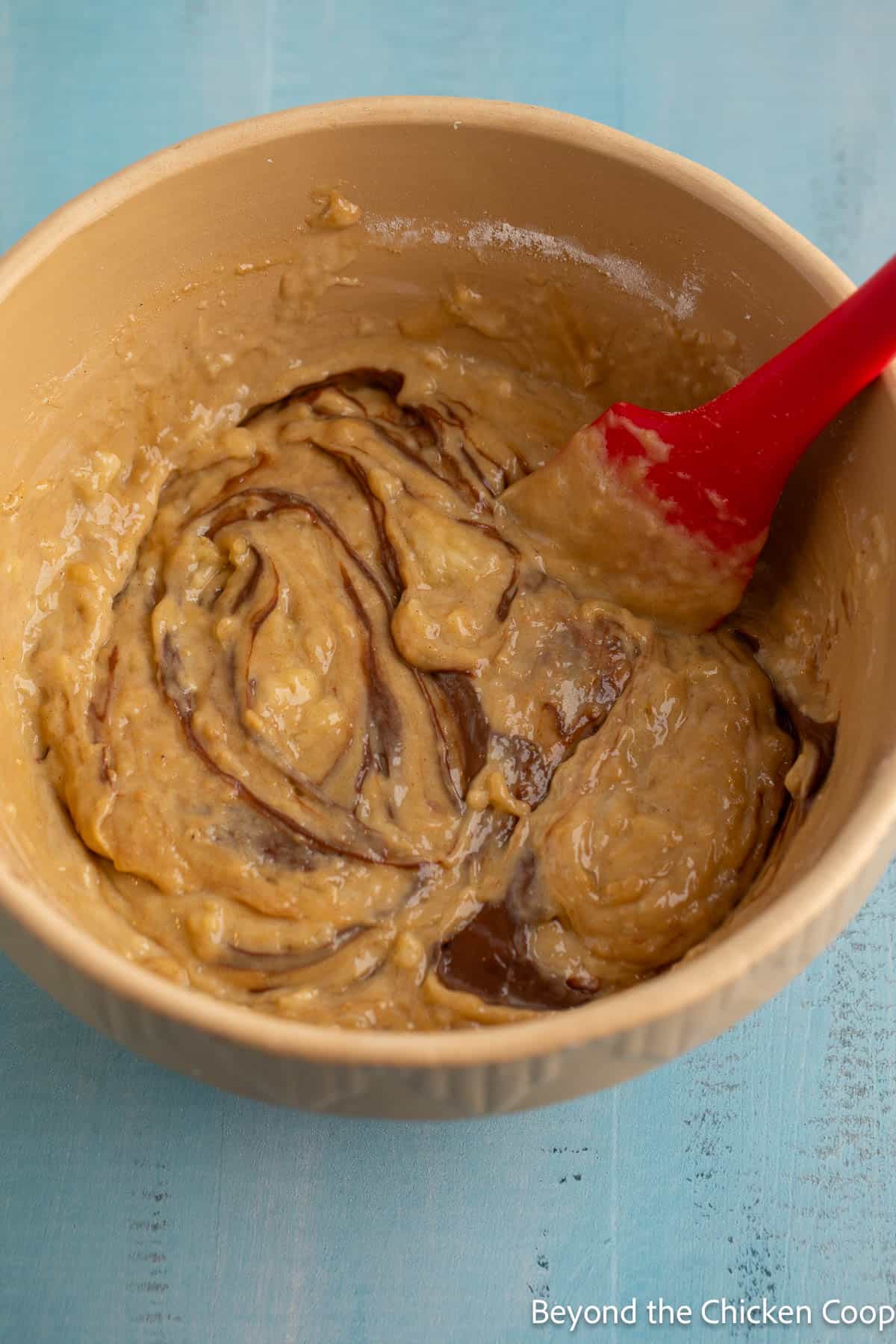 Swirling batter together with chocolate spread. 