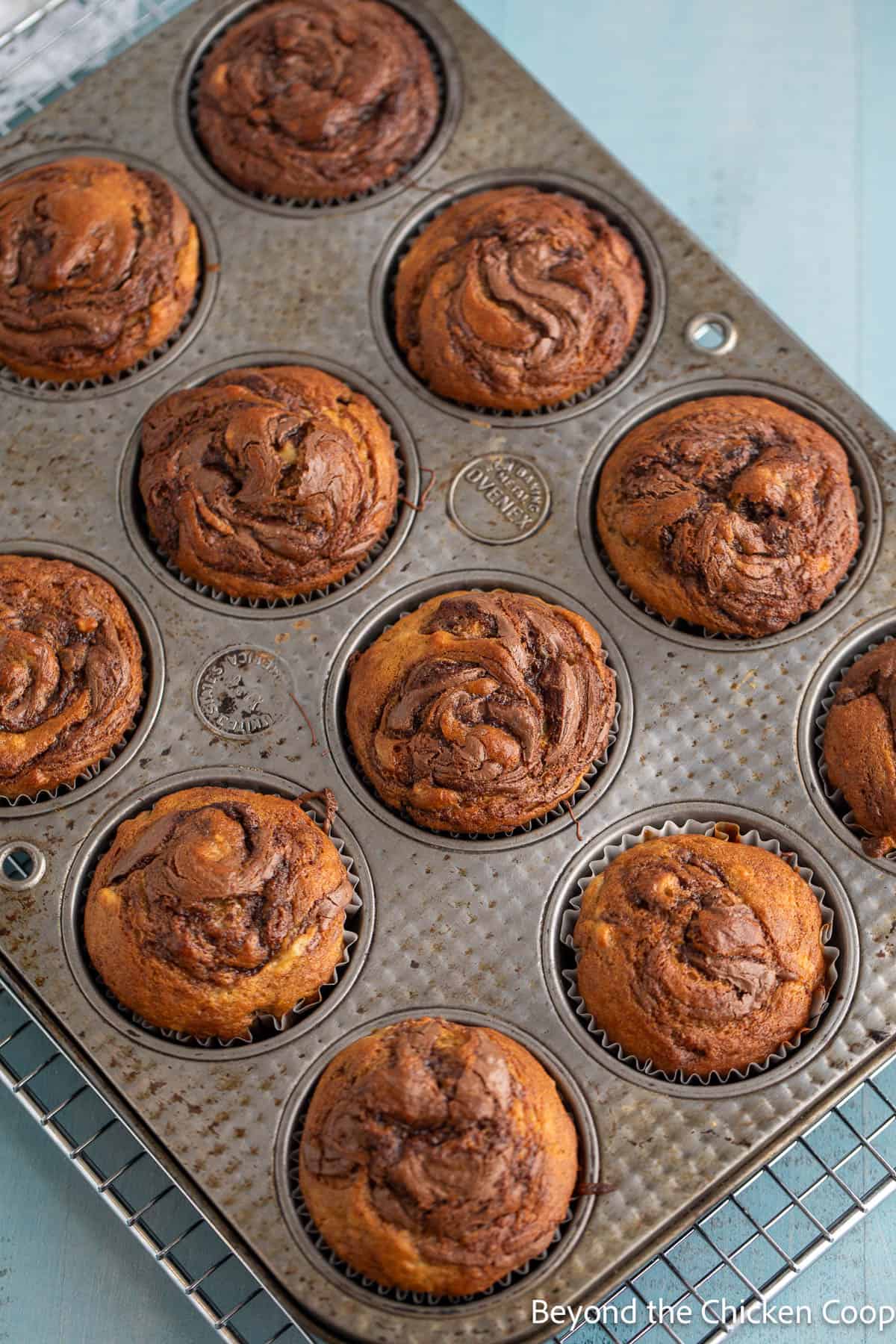 Baked muffins in a baking tin. 