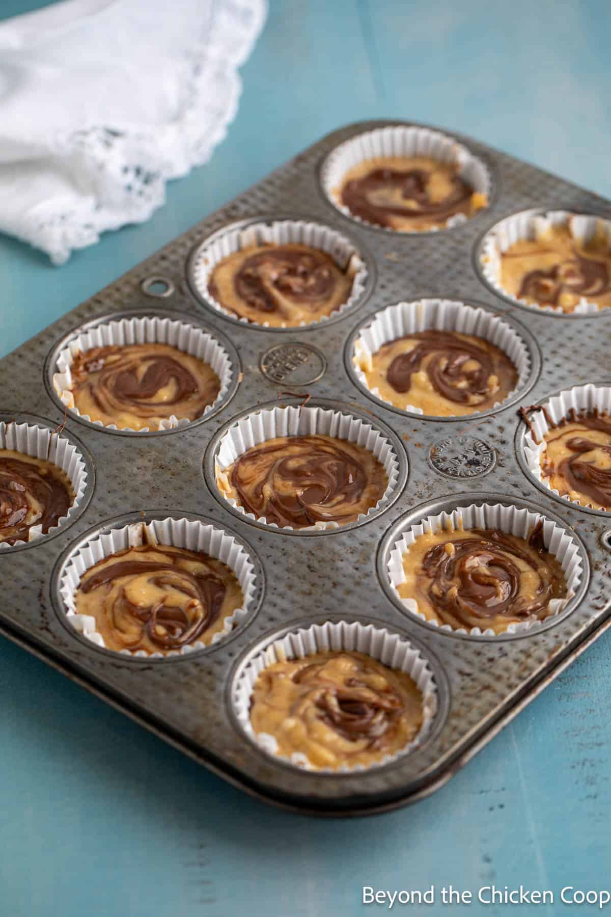 Nutella swirled muffins ready for the oven. 