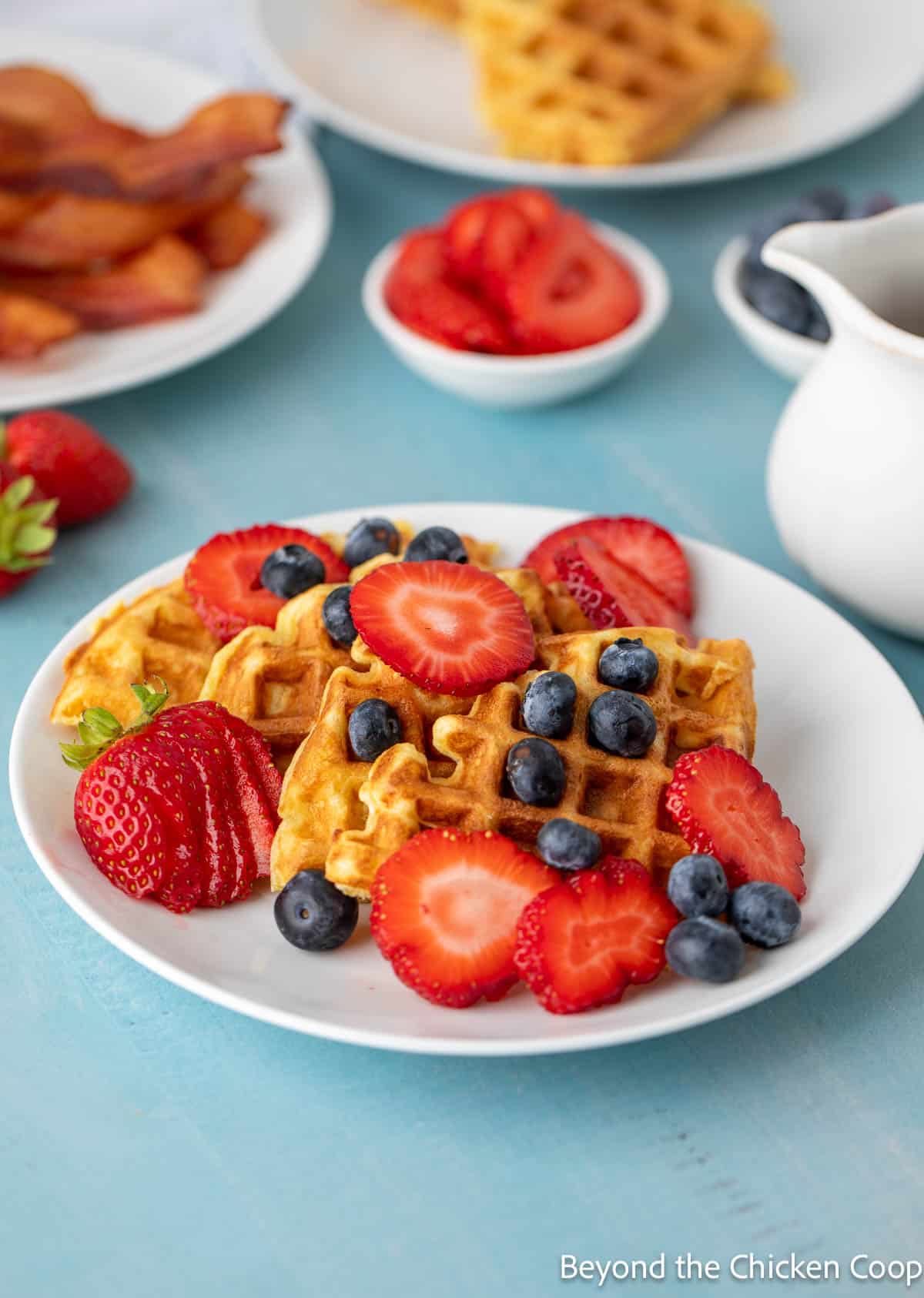 Waffles topped with fresh berries.