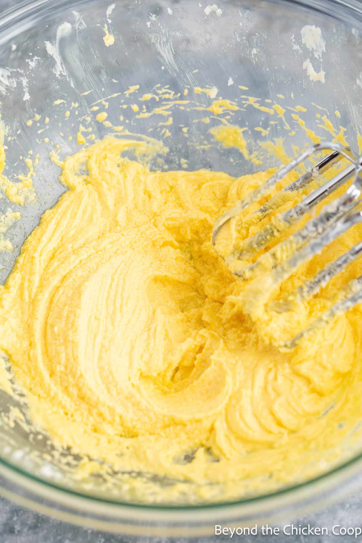 Whipped butter and sugar in a mixing bowl. 