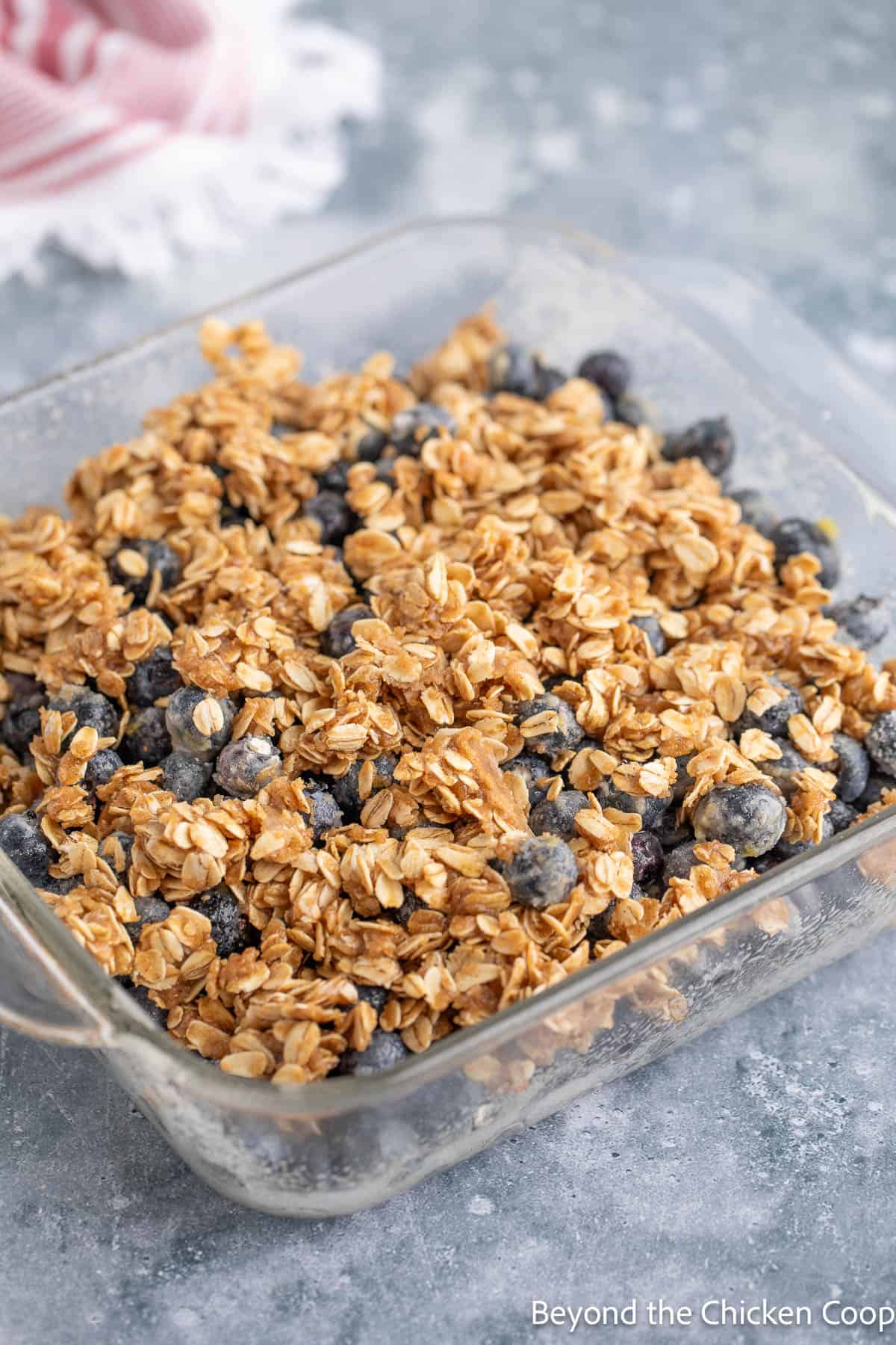 Oat topping sprinkled over blueberries. 