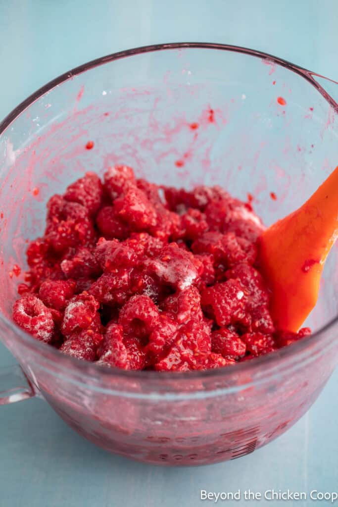Raspberry filling in a large glass bowl. 