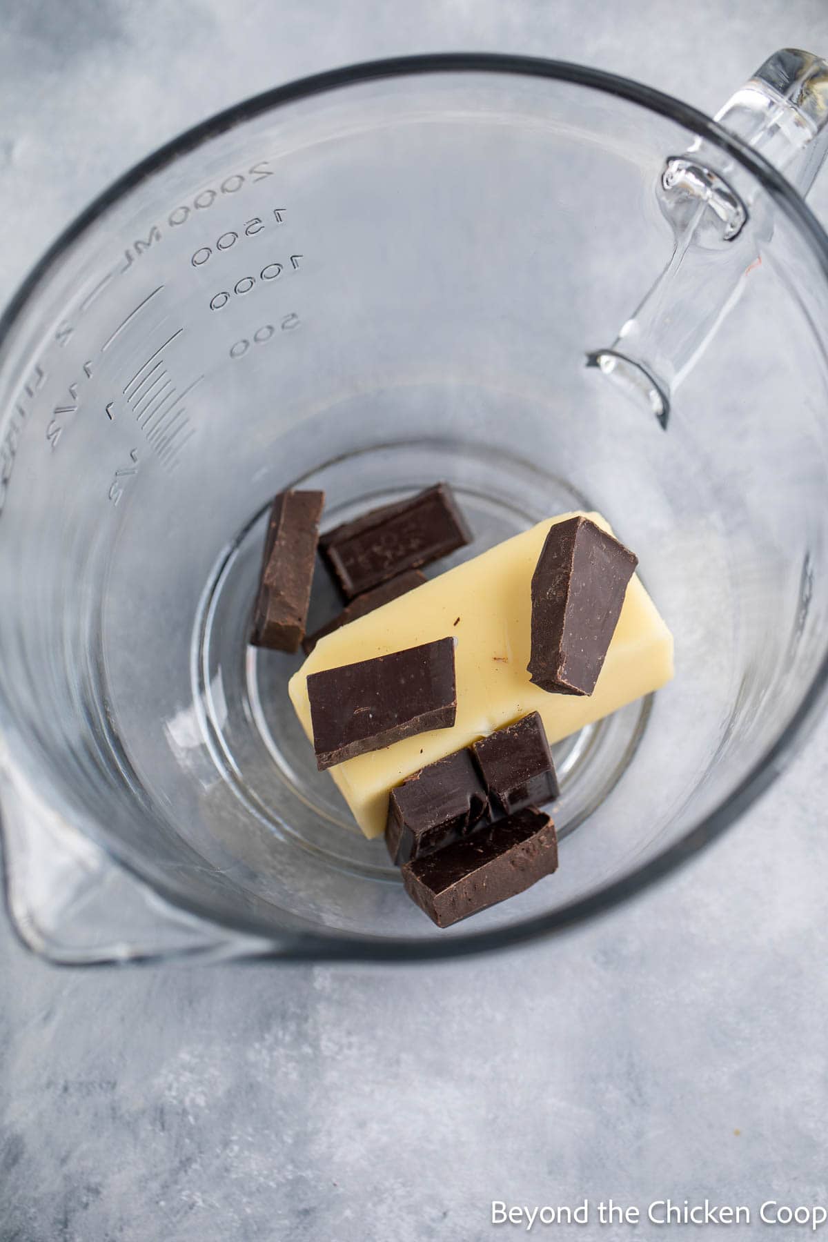Butter with broken chocolate pieces in a bowl. 