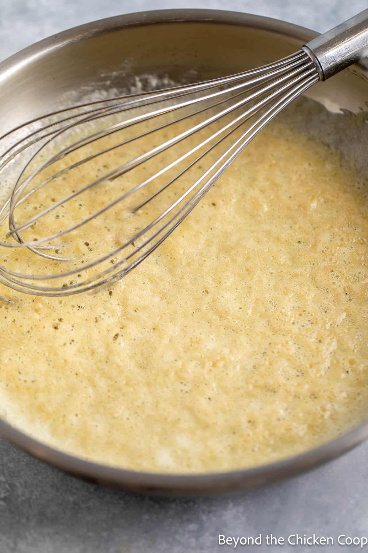 Cooking a roux in a large pan. 