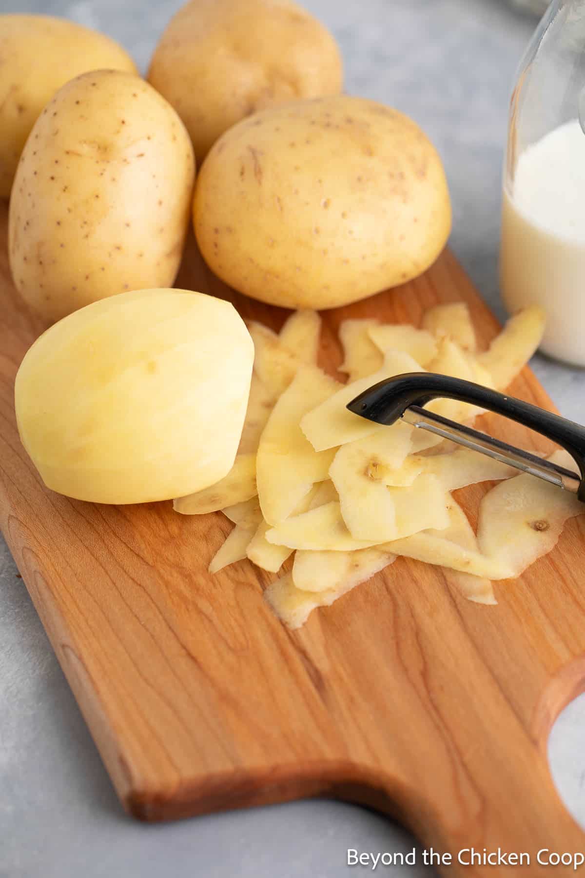 Peeling yukon potatoes. 