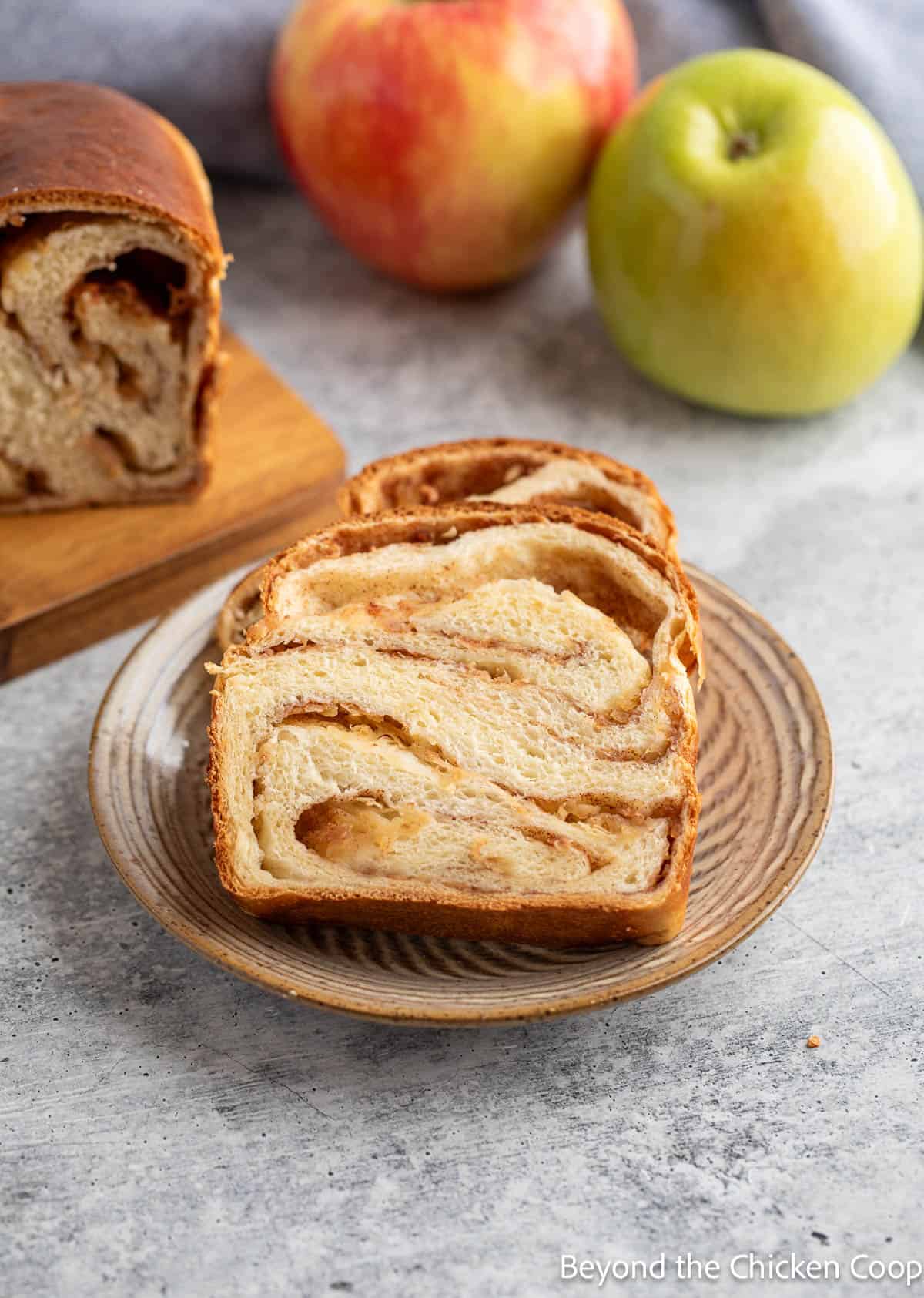 Sliced apple babka on a small plate. 
