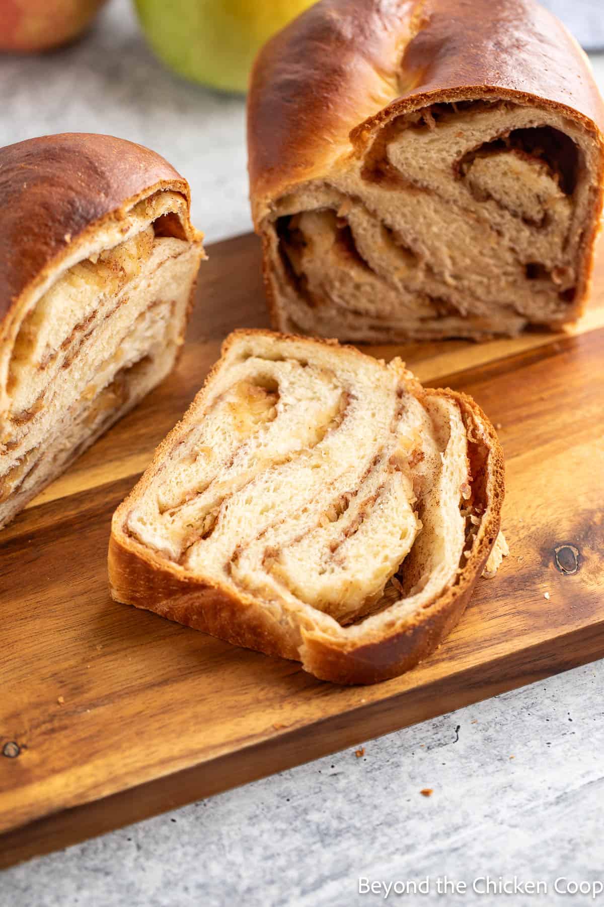 Sliced apple cinnamon babka on a board. 