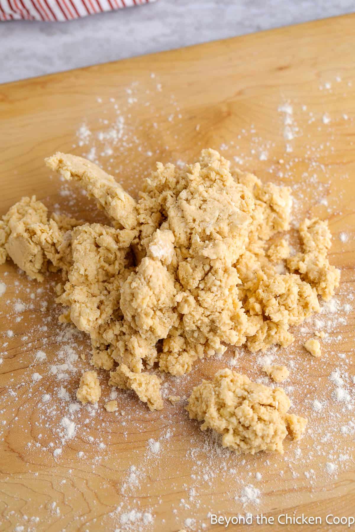 Scone dough on a wooden board.