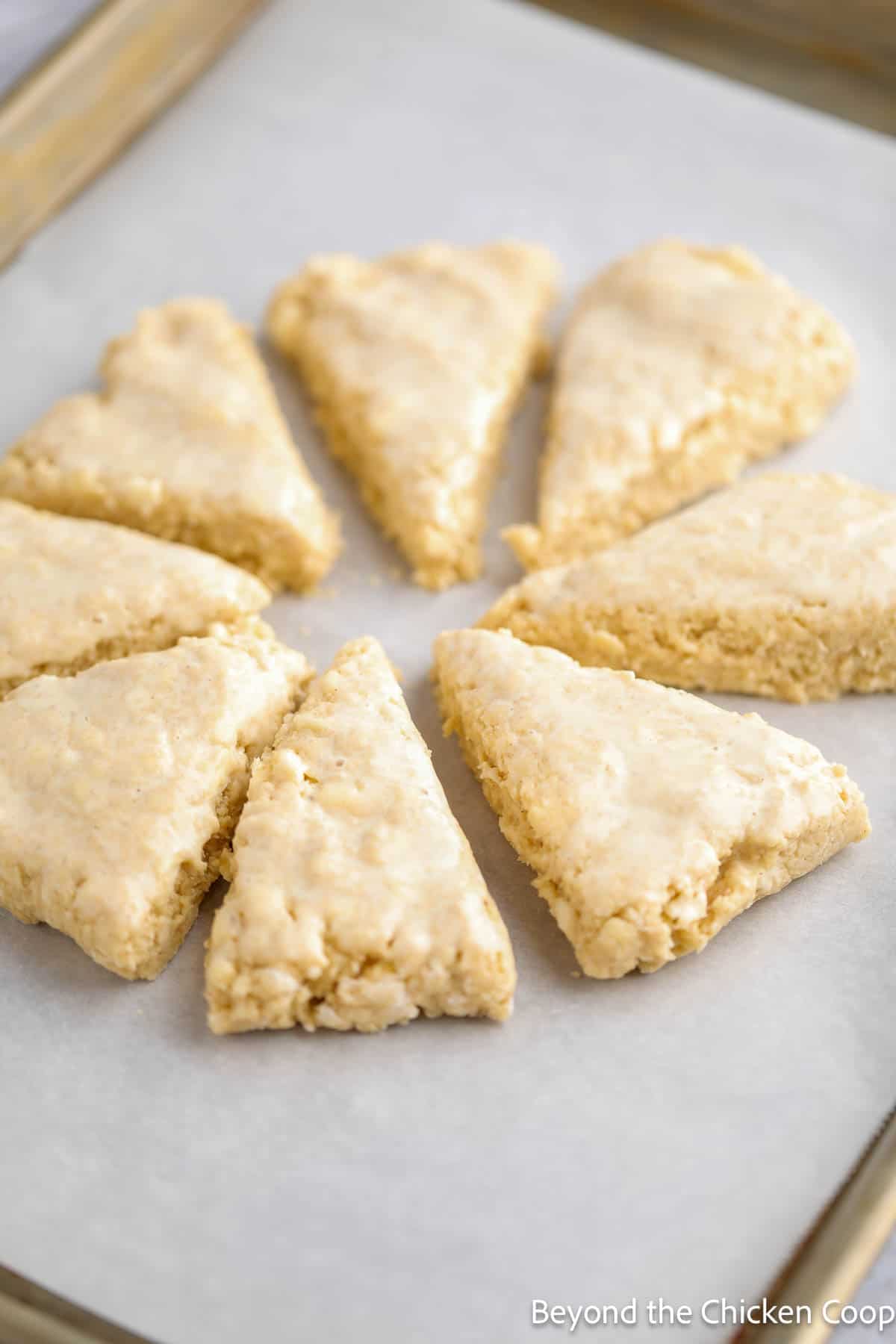 Unbaked scones on a baking sheet. 