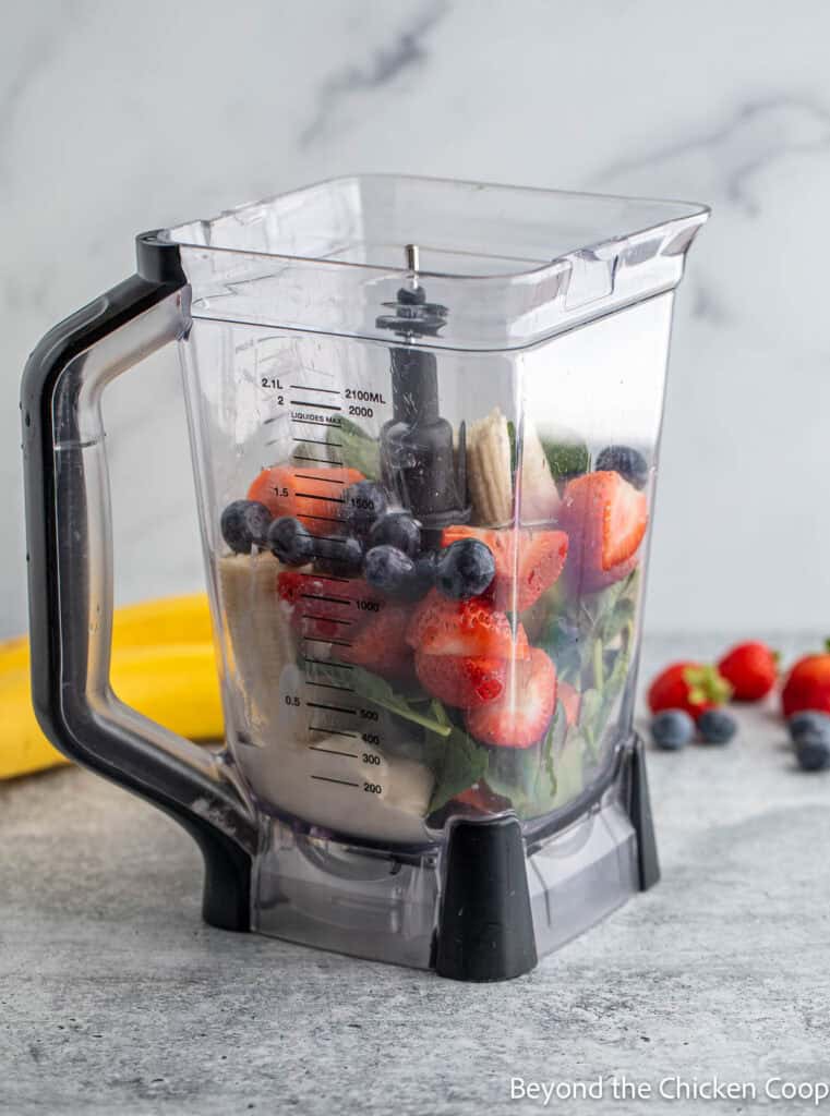 Fruit and veggies in a blender.
