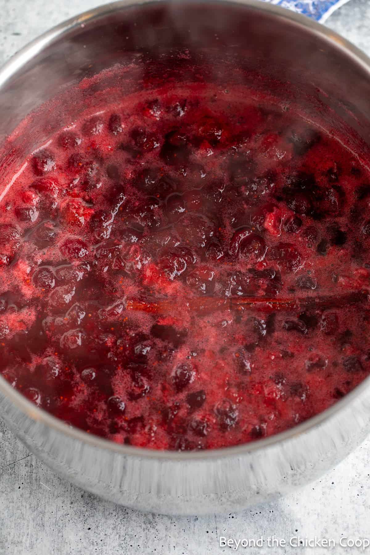 Cooked cranberry sauce in a large pot. 