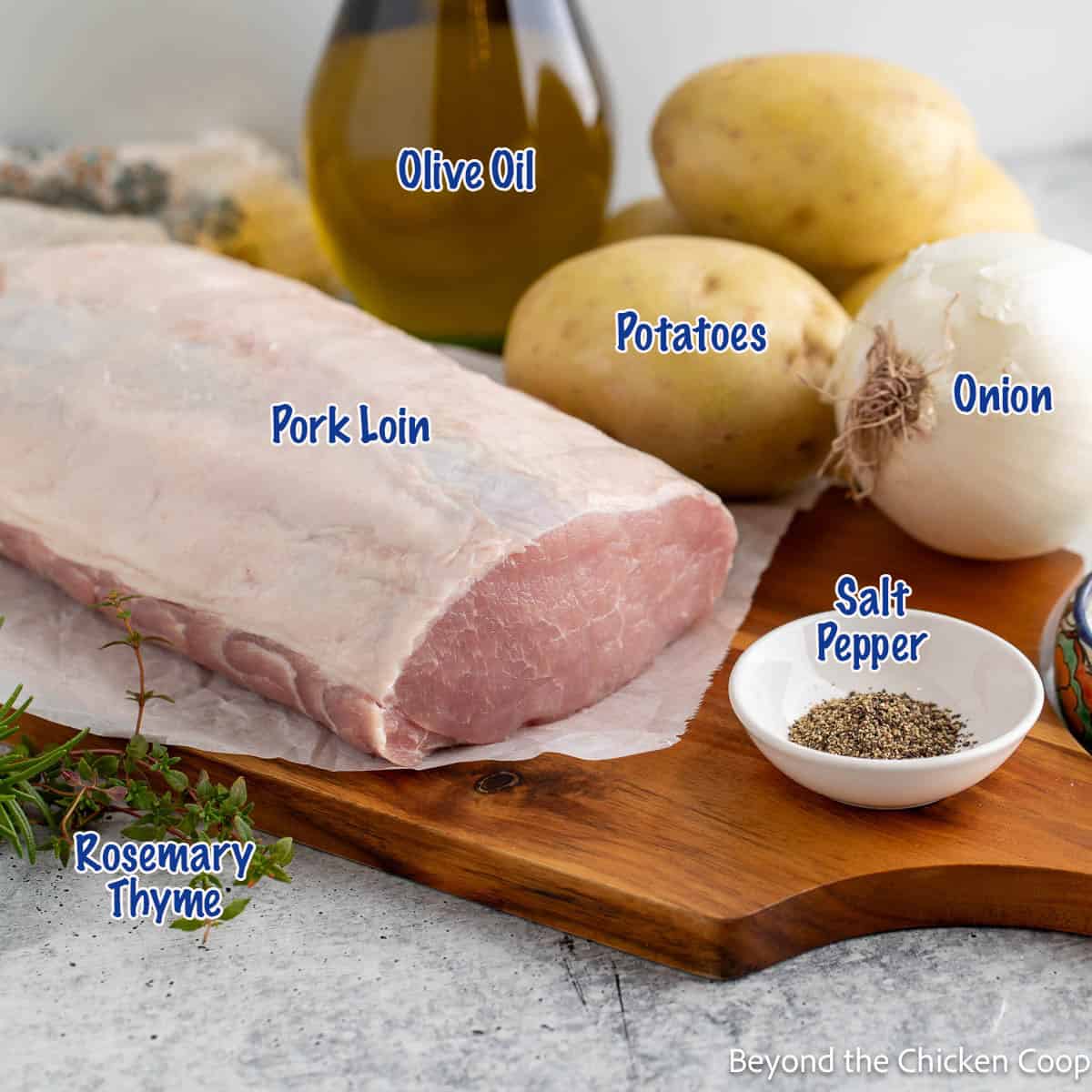 Ingredients for making a pork roast with potatoes and onions.