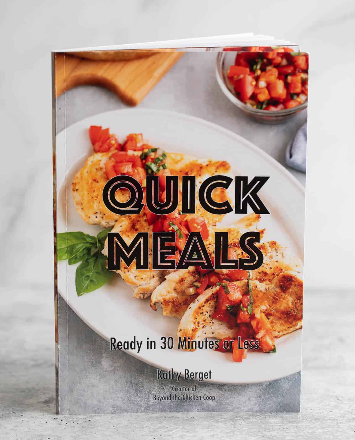 A cookbook titled Quick Meals. 