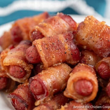 Bacon Wrapped Little Smokies on a white platter.