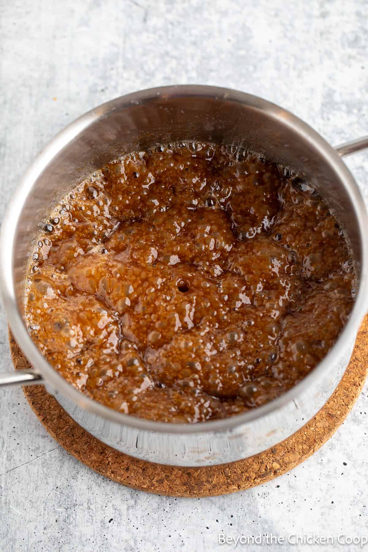 Boiling caramel in a saucepan.