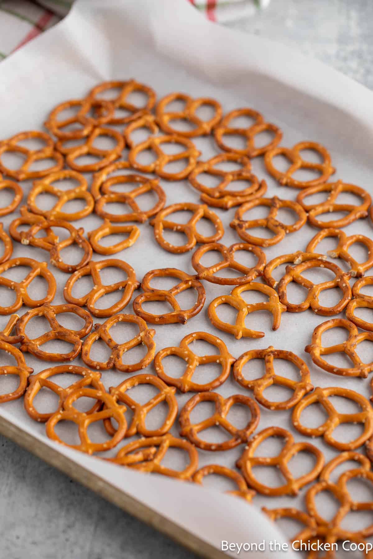 Pretzels on a baking sheet lined with parchment paper. 