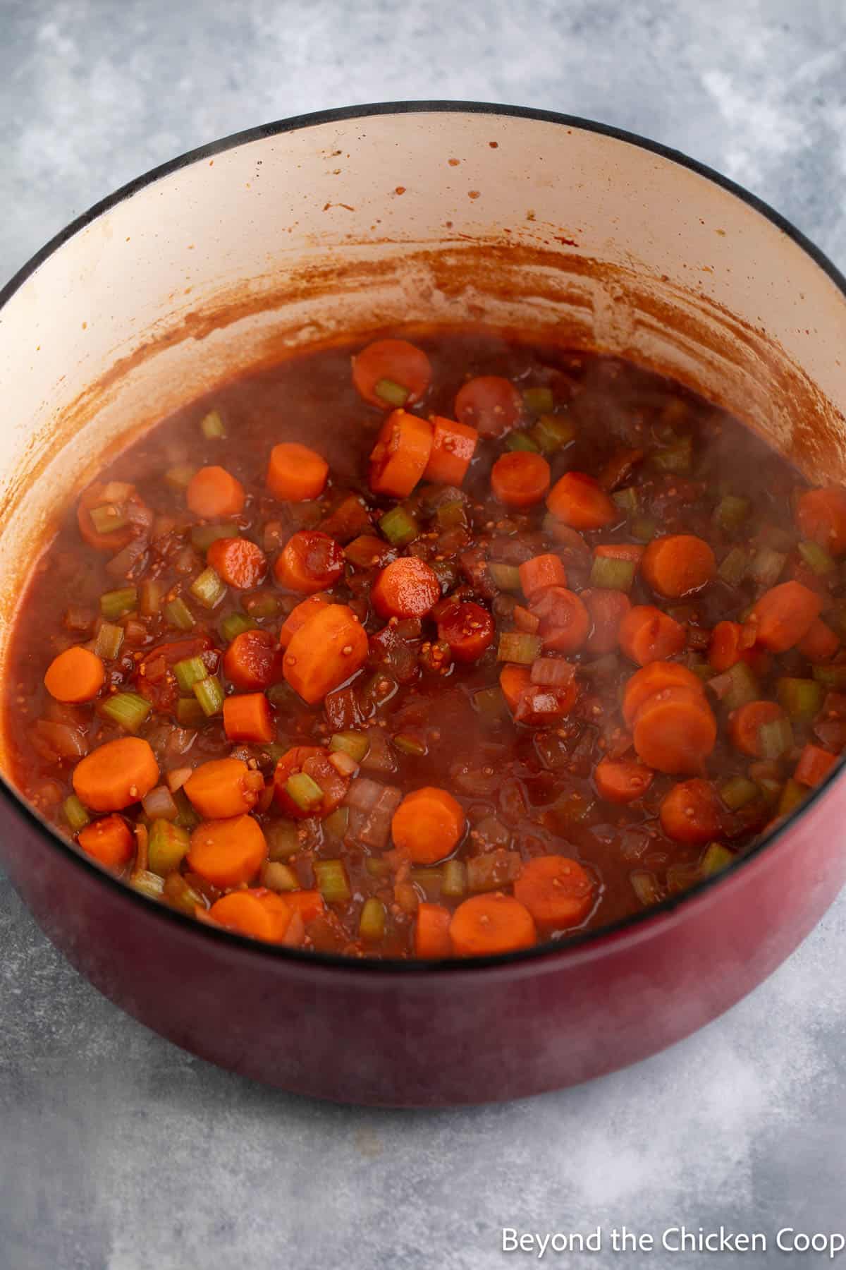 Deglazing a pan with red wine. 