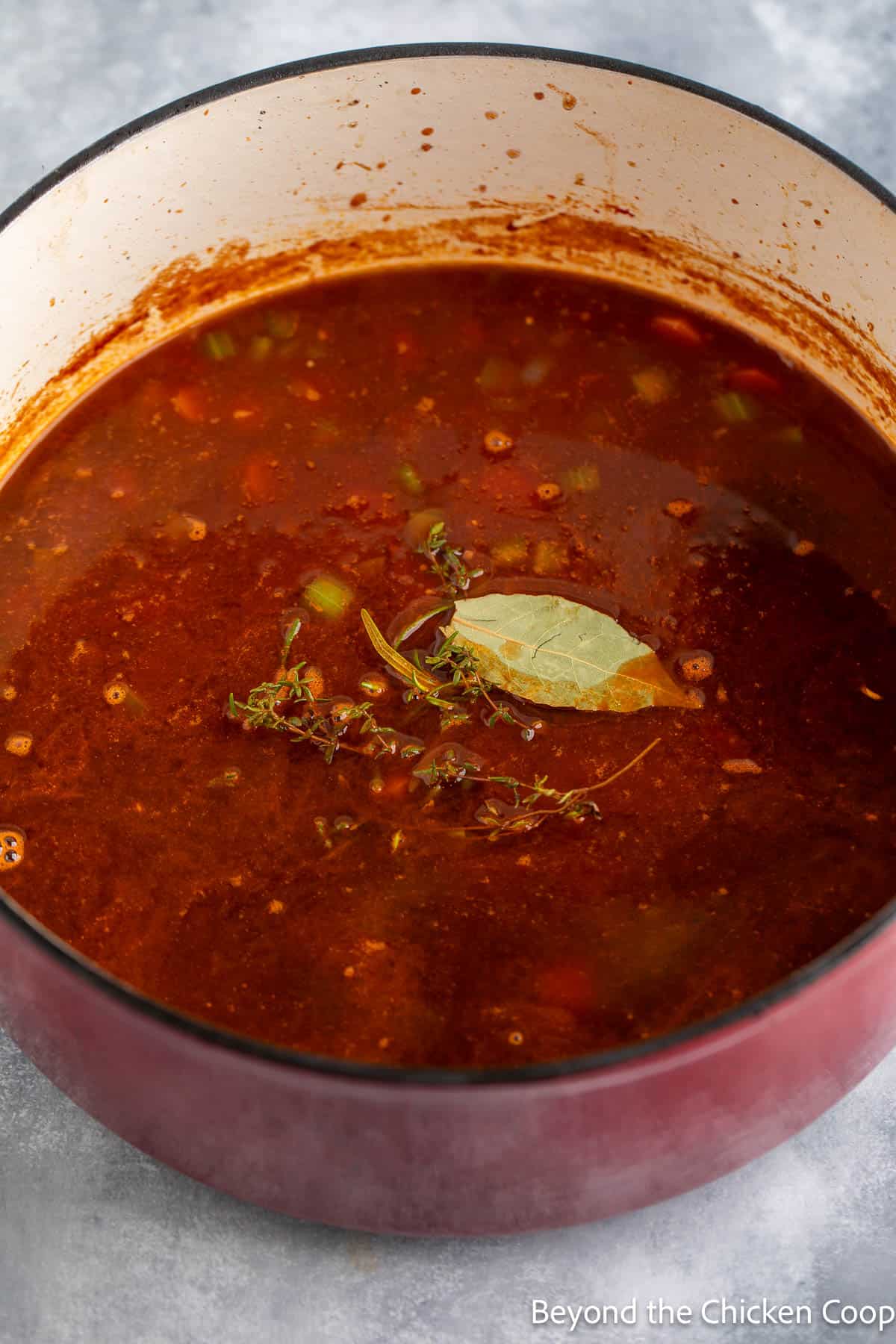 Fresh herbs in a soup pot. 