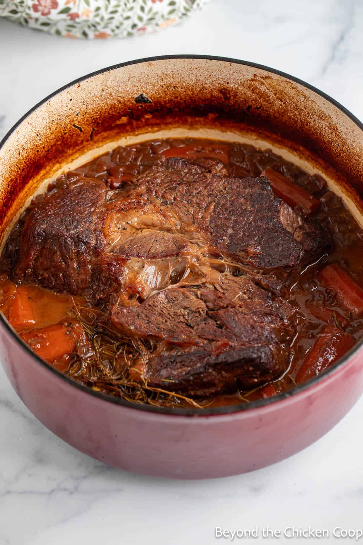 A braised pot roast in a dutch oven. 