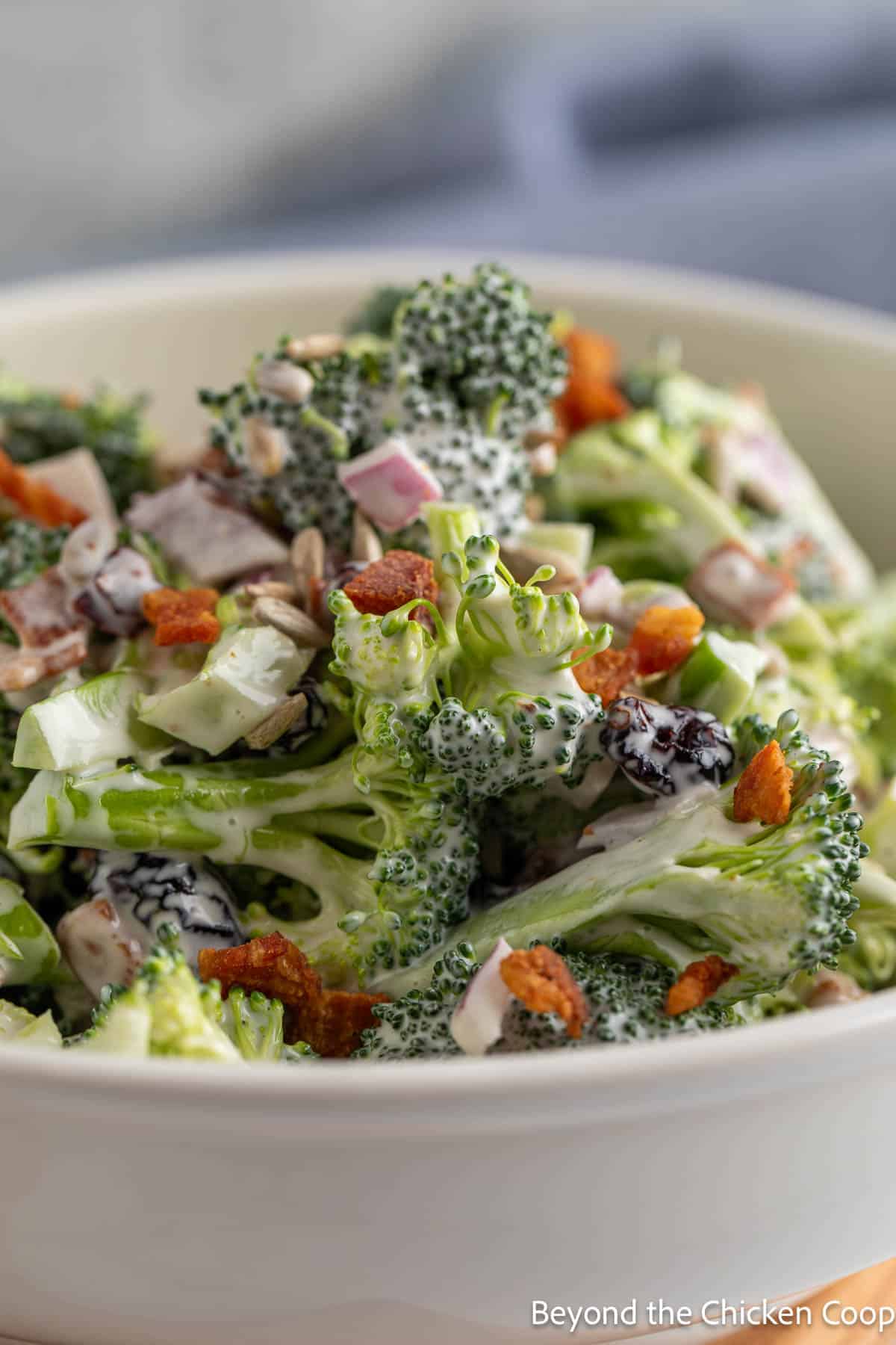 Broccoli salad with bacon and red onions in a bowl. 