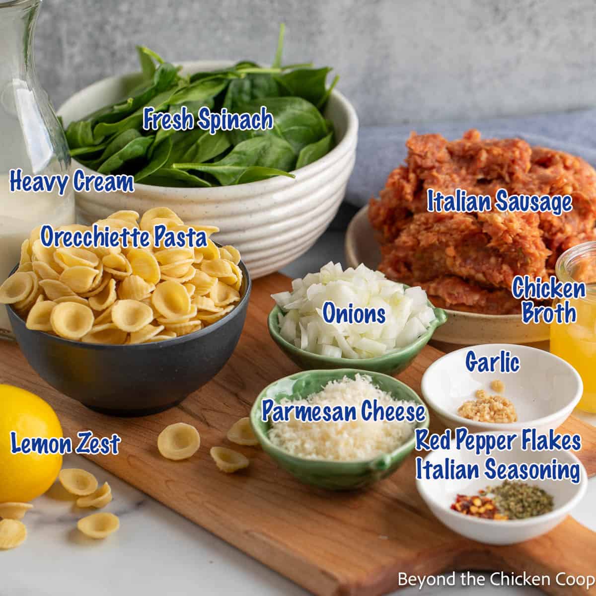 Small bowls filled with ingredients for making a pasta skillet. 