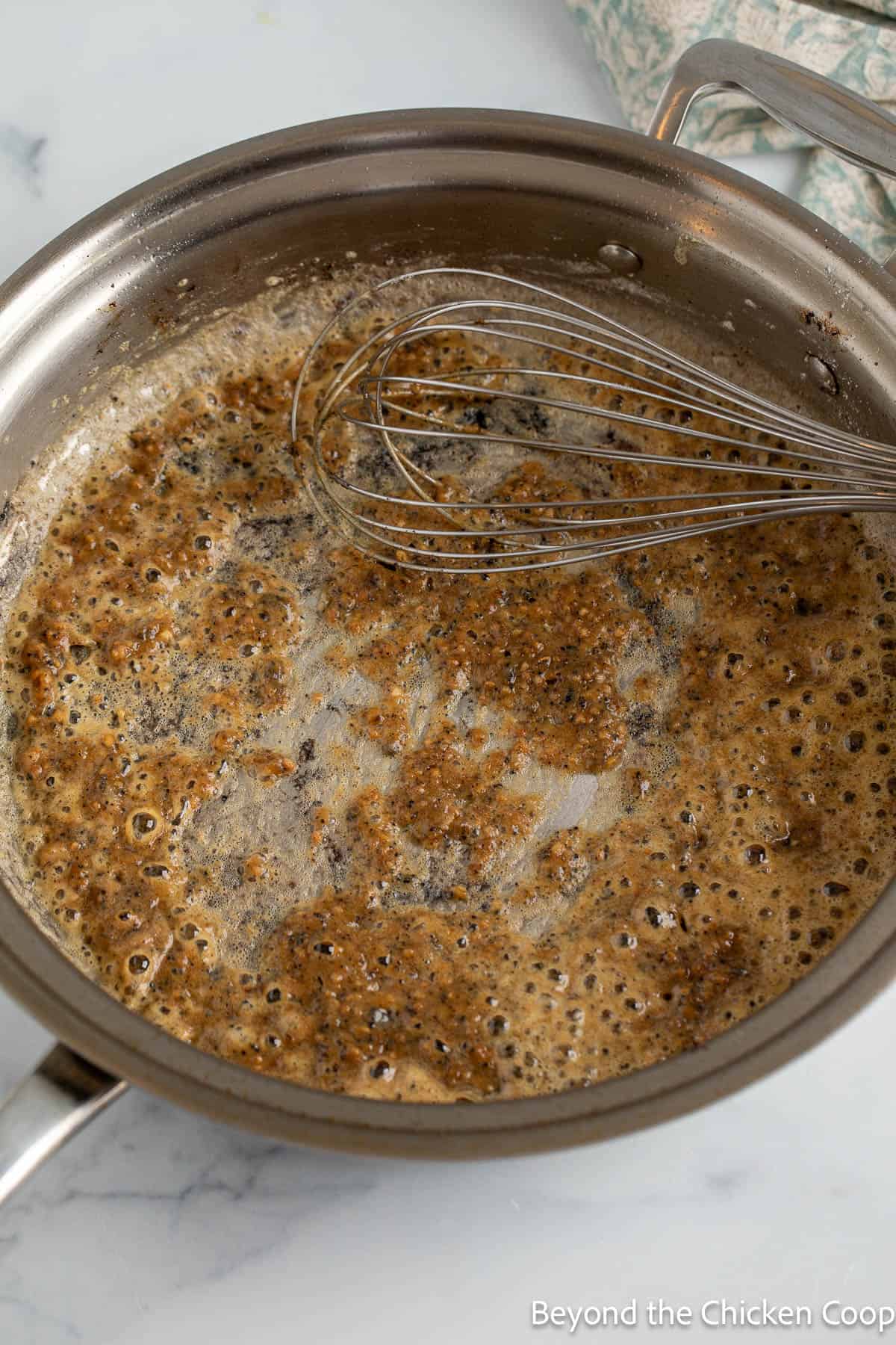 Browned butter and garlic in a pan.