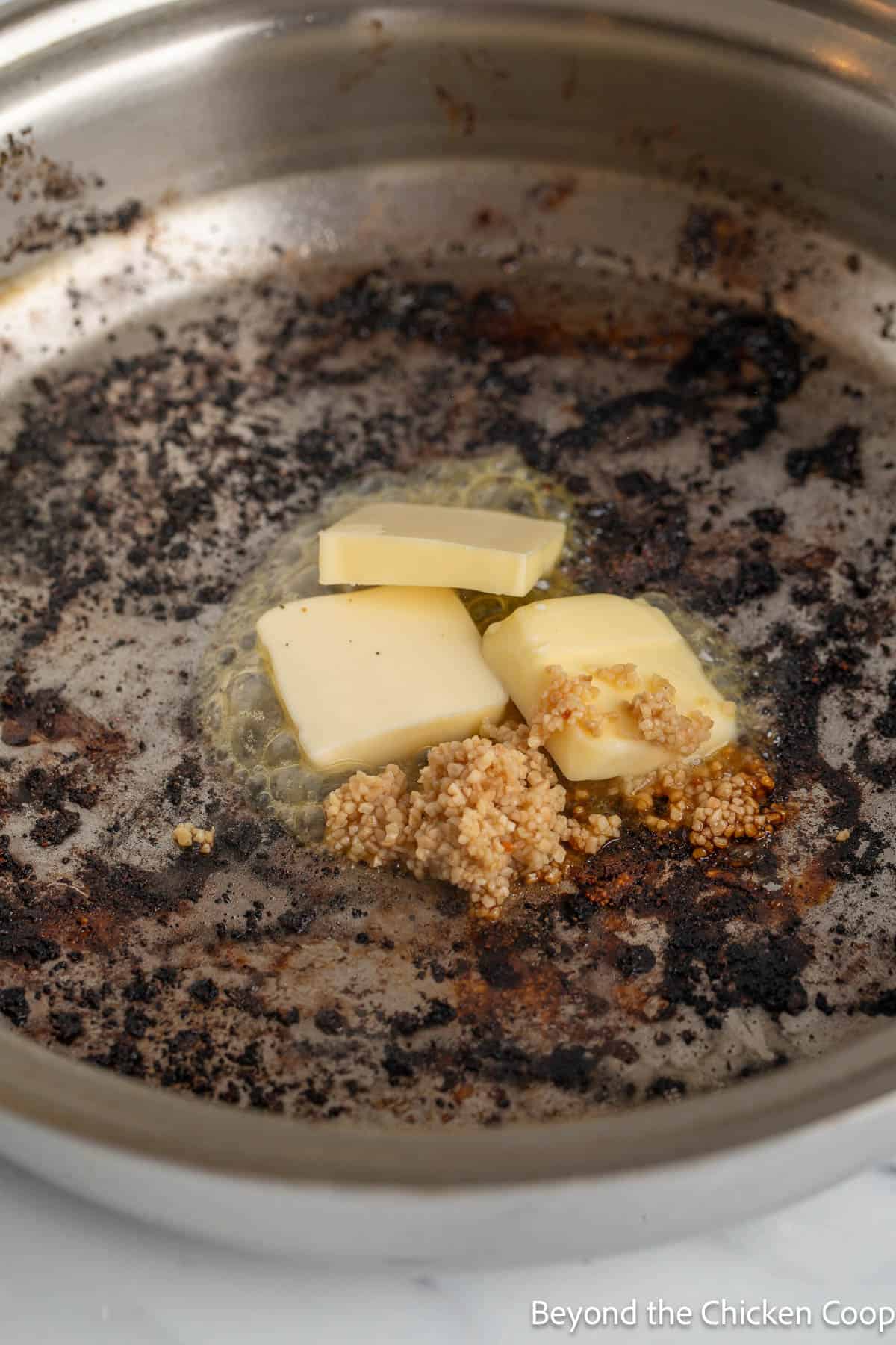 Butter and garlic in a pan. 