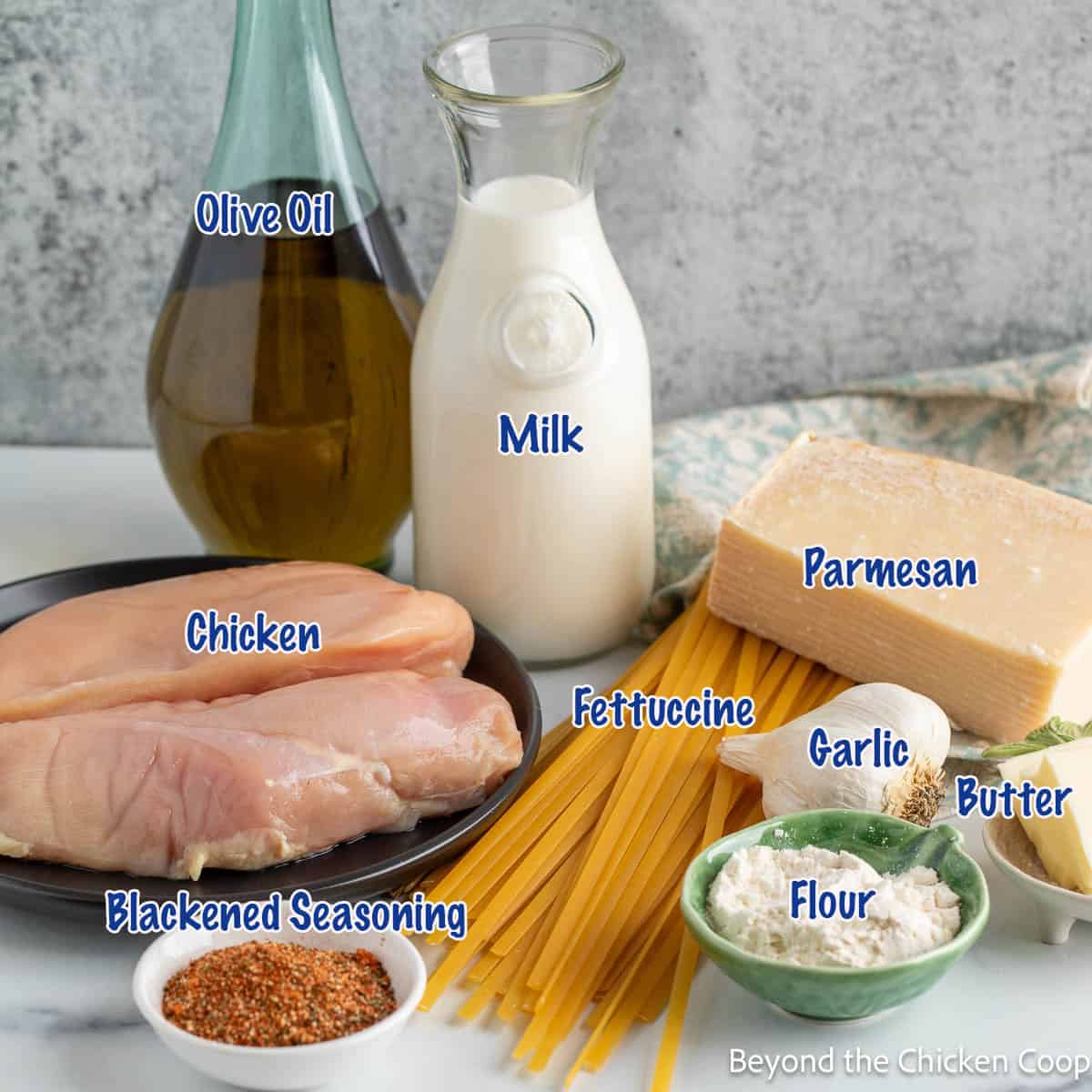 Ingredients for making chicken alfredo pasta. 