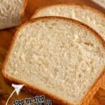Sliced white bread on a wooden board.