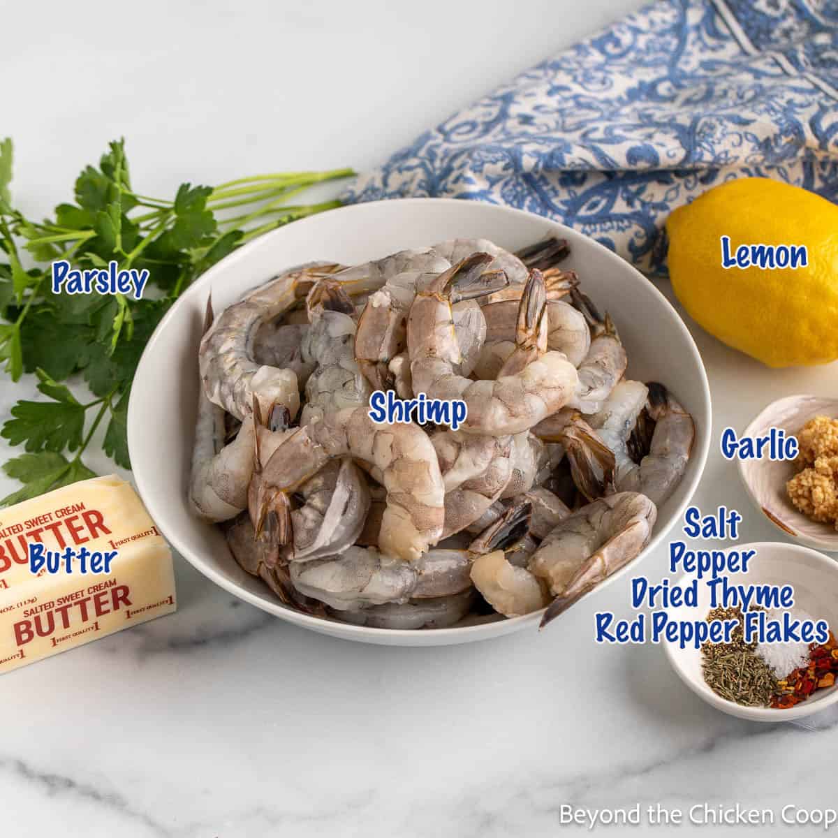 Raw shrimp with other ingredients used in a recipe. 
