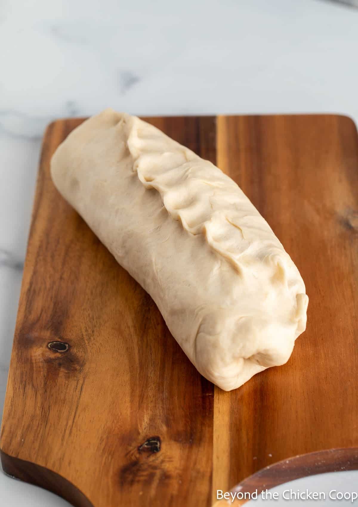 Bread dough rolled into a log. 