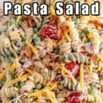 Pasta salad with tomatoes and bacon.