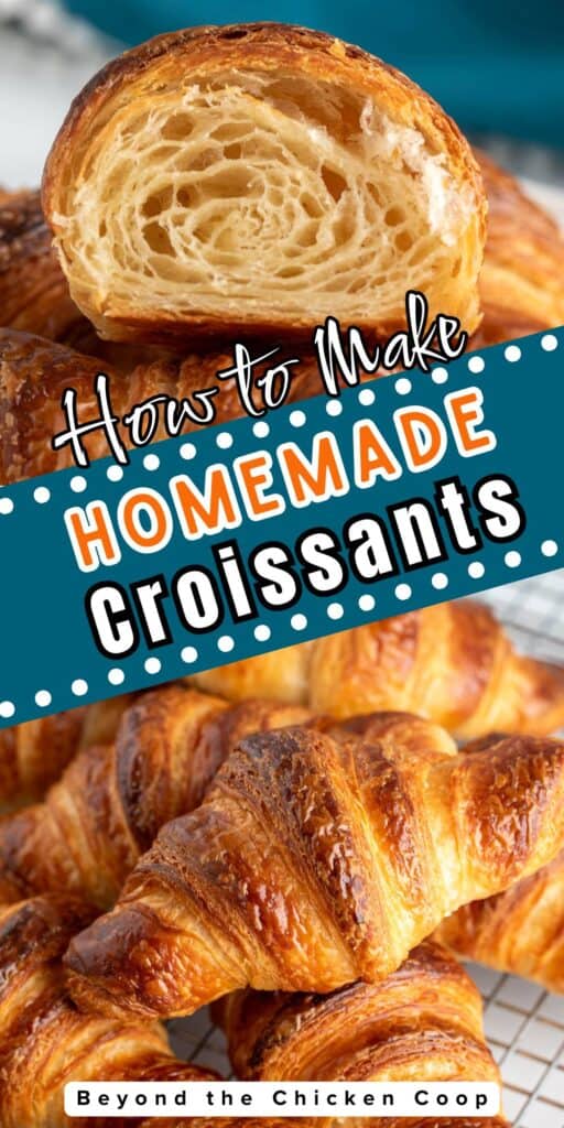 Flaky croissants stacked on a baking rack.