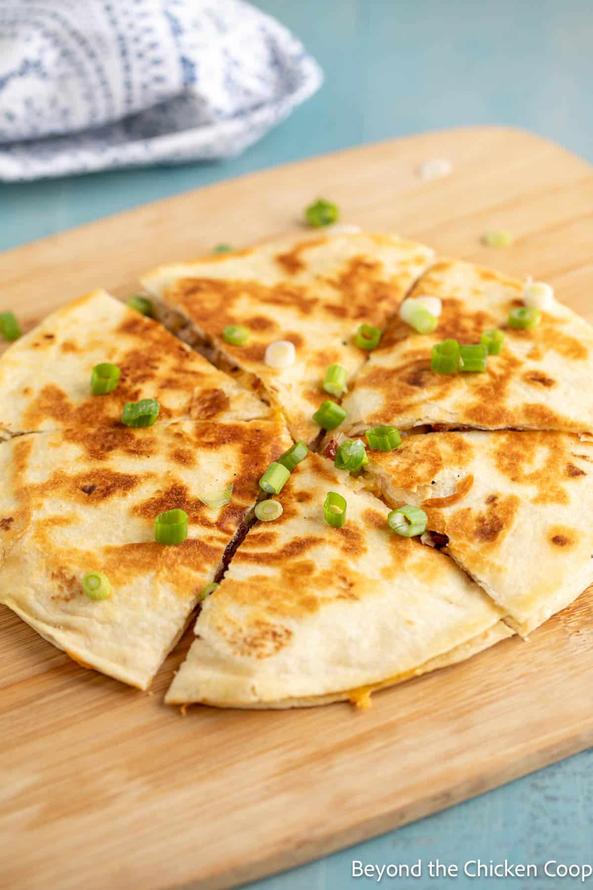 Crispy quesadilla cut into wedges. 