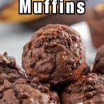 Chocolate muffins with mini chocolate chips in a stack.