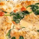 Tuscan chicken in a creamy sauce with spinach and tomatoes.
