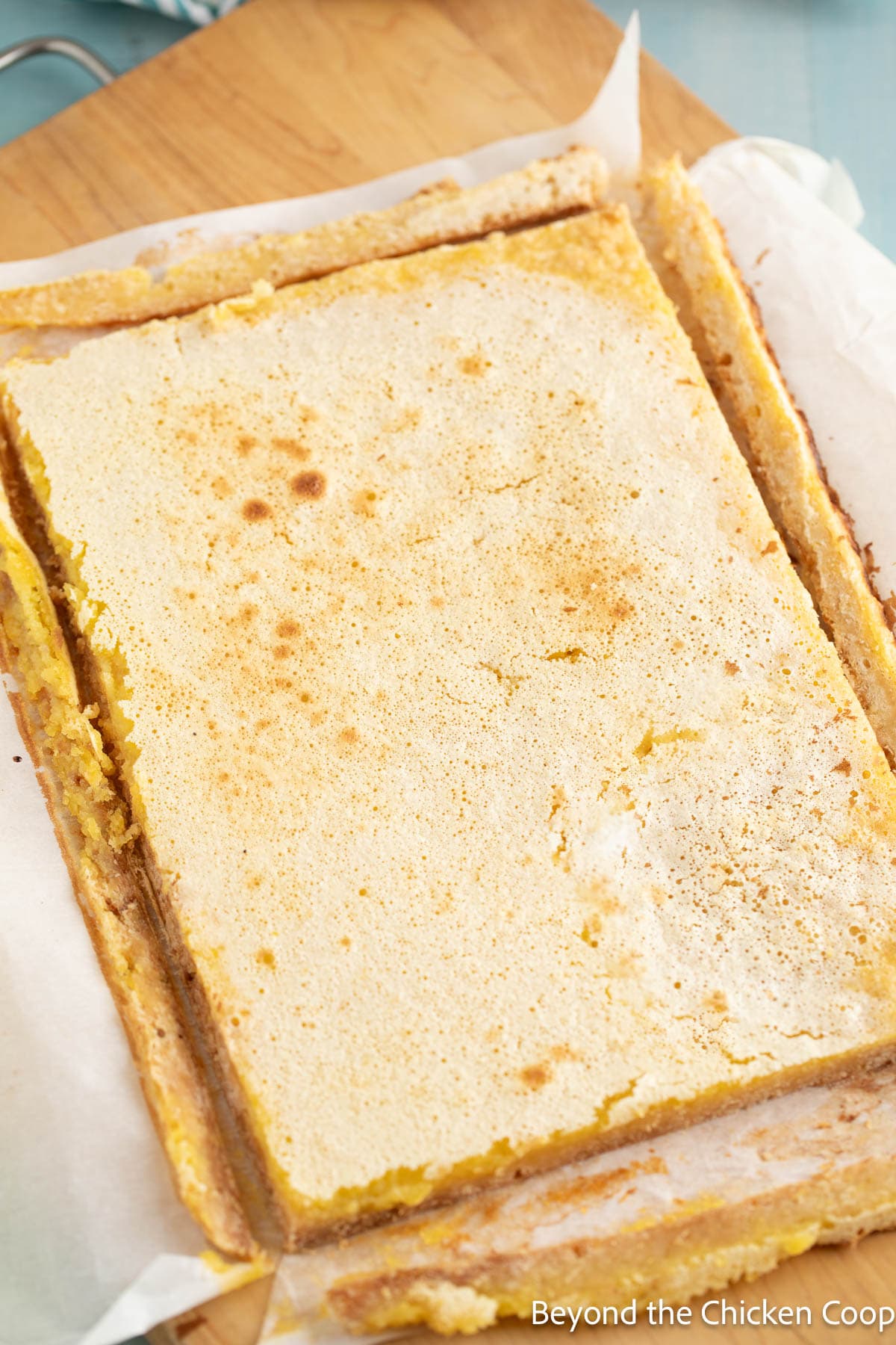 Trimming the edges of off lemon bars.