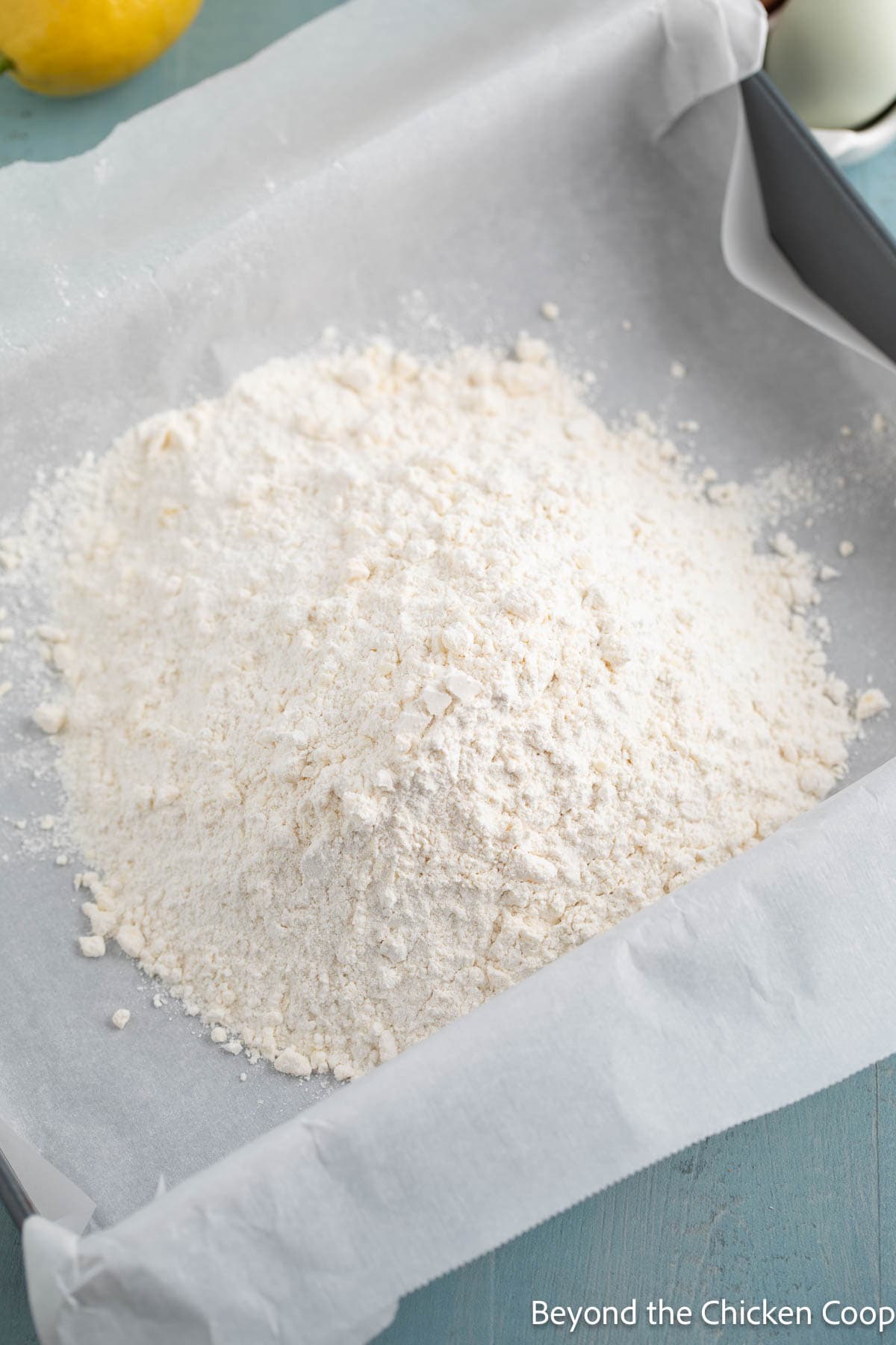 Flour mixture in a lined baking pan. 