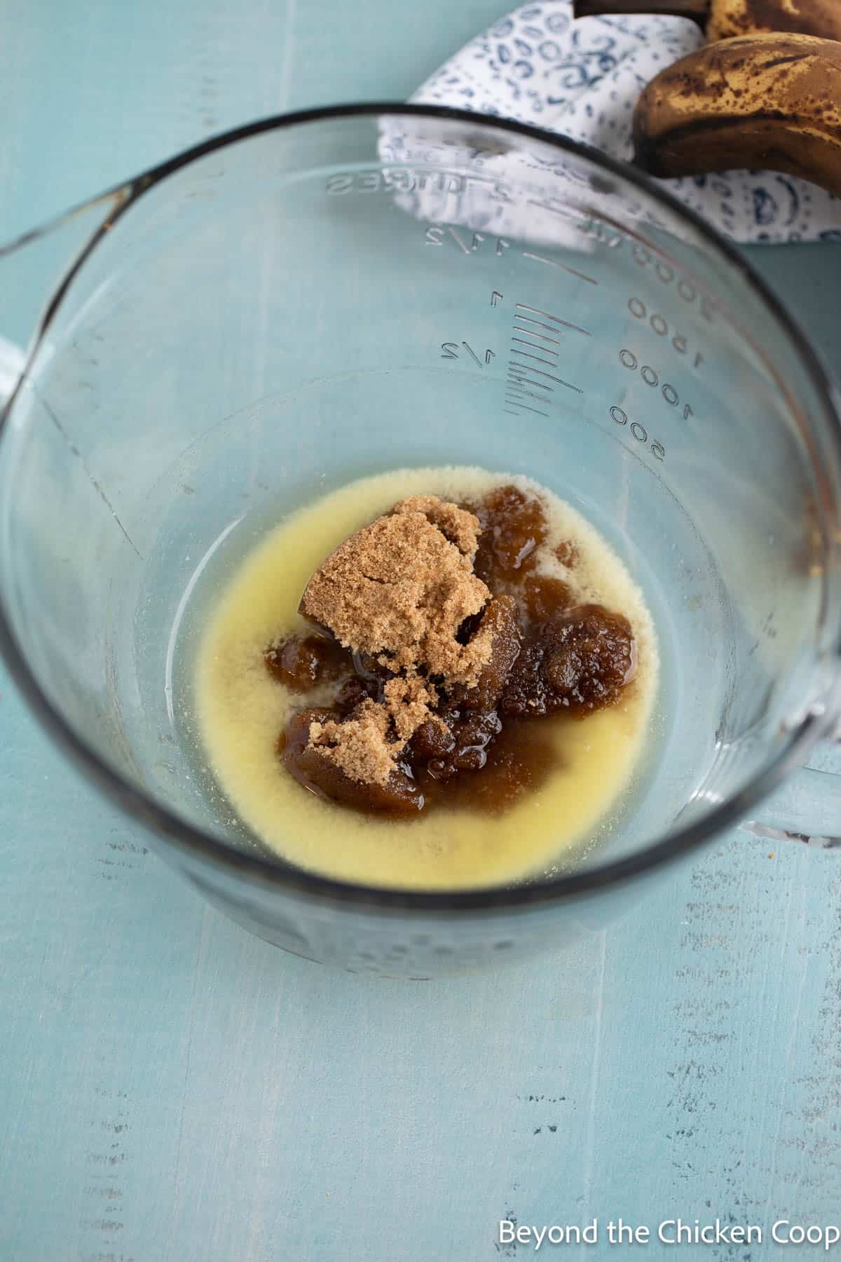Melted butter with brown sugar in a glass bowl. 