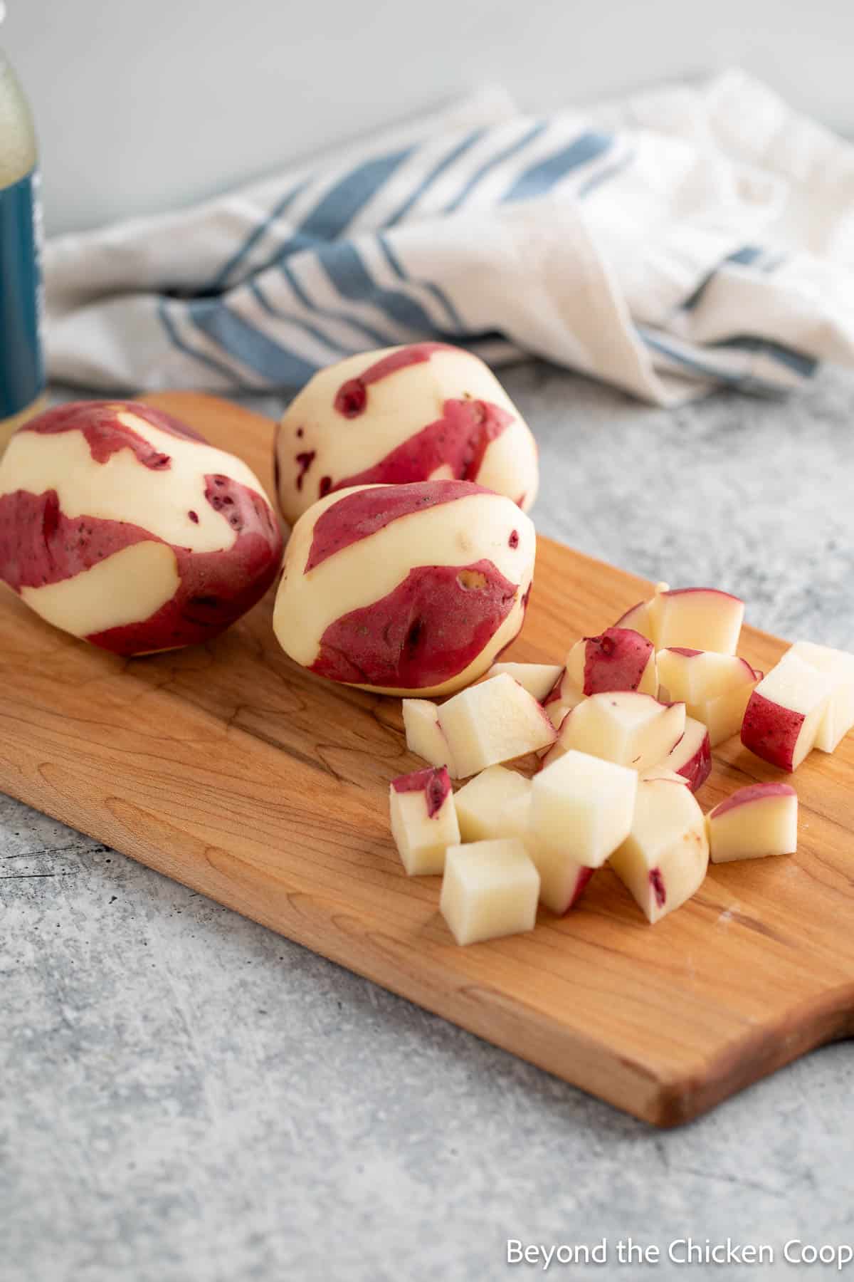 Chopping red potatoes.