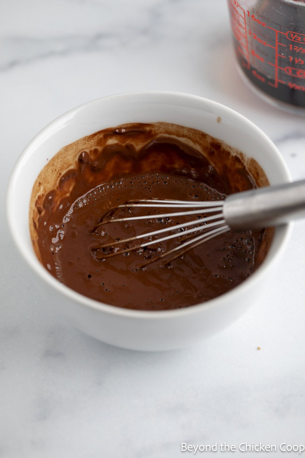 Chocolate sauce in a white bowl. 