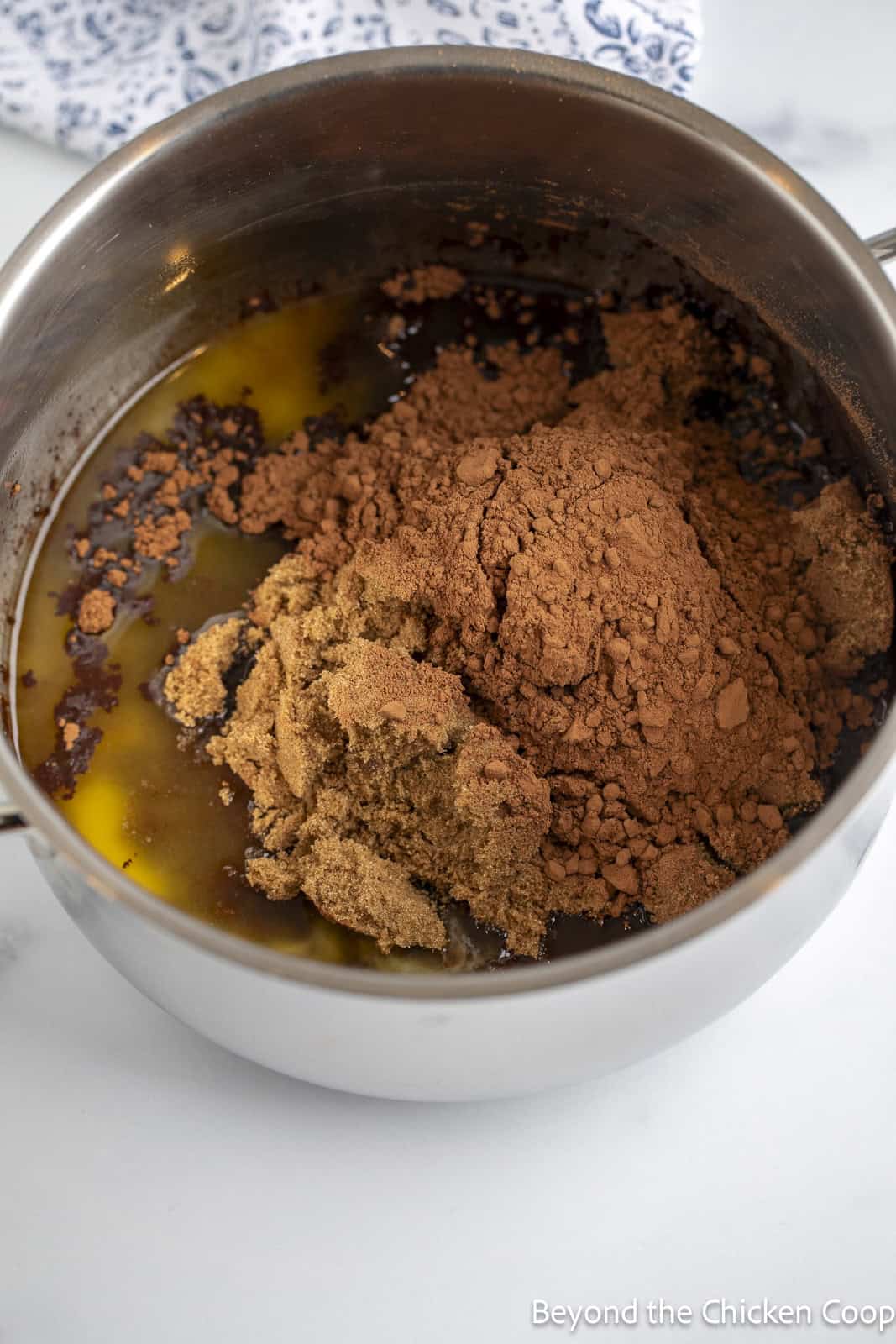 Butter and cocoa in saucepan. 