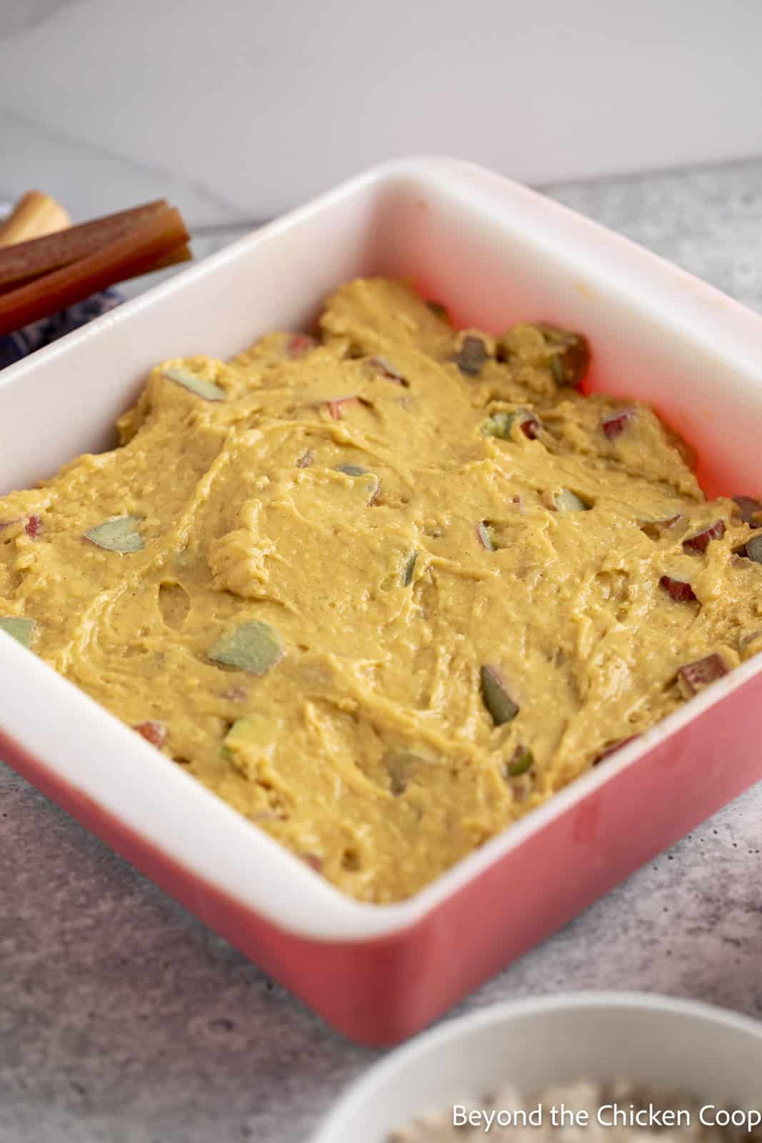 Coffee cake batter in a cake pan.